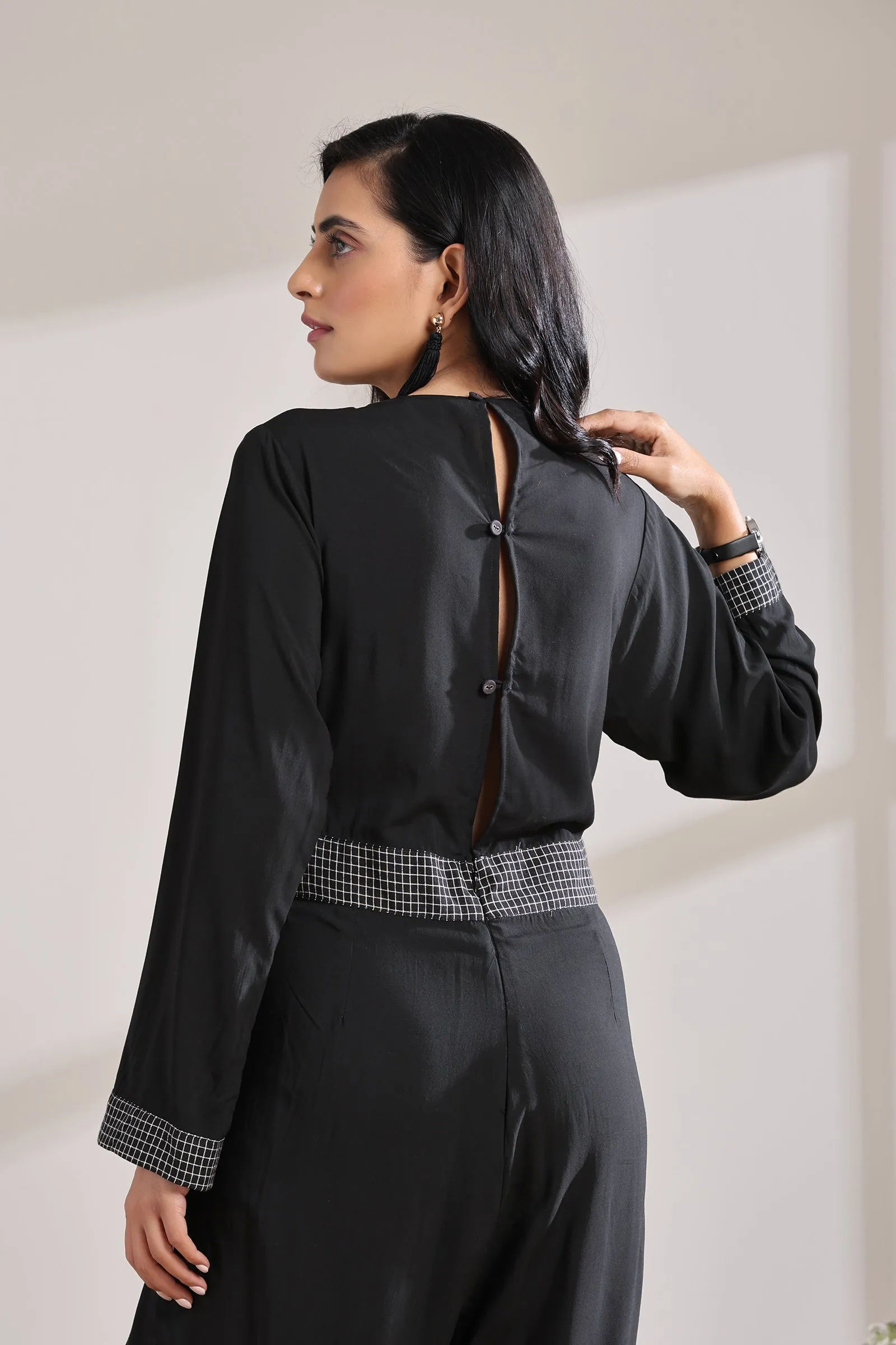 BELTED CHECK JUMPSUIT